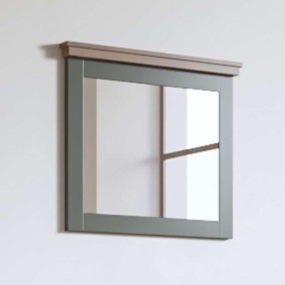 A rectangular hallway mirror with a green frame and a clear mirrored surface, mounted on a wall.