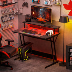 HOMCOM Gaming Desk with LED Lights and Power Outlets, 100 x 60cm Z Shaped Computer Desk with Monitor Stand and Steel Frame, PC Gaming Table for Home Office, Black